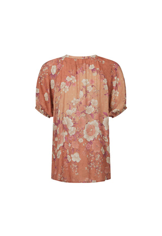 a-short-sleeve-blouse-with-a-gathered-pleated-bodice-and-a-soft-floral-print-in-dusty-pink-peach-and-cream-shown-against-a-plain-white-background