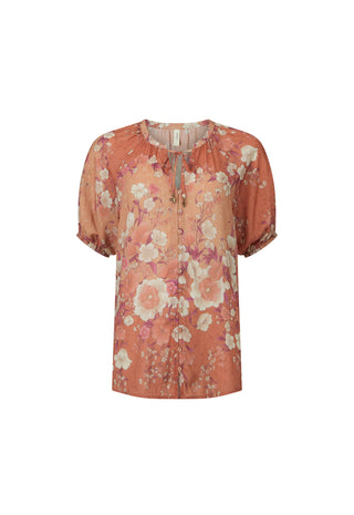 a-short-sleeve-blouse-with-a-gathered-smocked-neckline-and-a-tie-front-closure-featuring-a-retro-floral-pattern-in-terracotta-orange-pink-and-cream-on-a-white-background