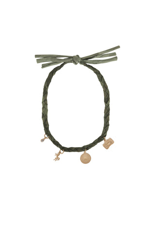 An olive green braided cord bracelet with a knotted tie at the top and three dangling charms in a rose gold tone, shown against a plain white background.