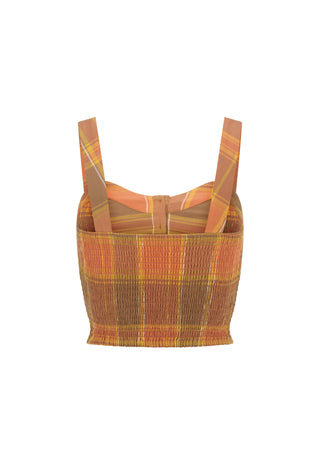 A cropped knit top with a textured smocked body and wide shoulder straps, featuring a warm plaid pattern in orange, brown, and yellow, shown against a plain white background.