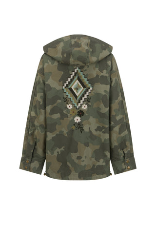 A hooded camouflage jacket shown from the back, featuring a large geometric diamond patch and embroidered floral details in green, black, white, and beige.
