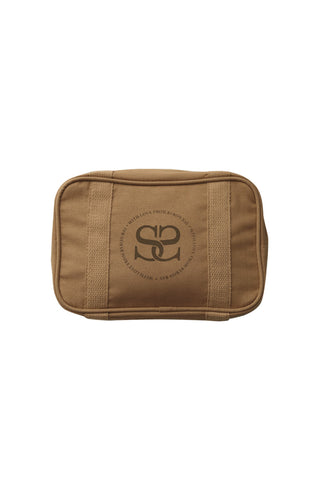 The camel Curators Club Cosmetic Bag. The bag features a zip opening and logo on the front.